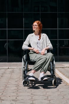 In front of a modern corporate building, a young woman sitting in a wheelchair confidently, symbolizing empowerment, inclusivity, and the strength to overcome challenges in the business world photo