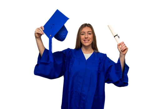 Happy graduating student wearing blue gown holding mortarboard and diploma photo