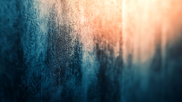 Textured Wall A close-up of an aged concrete wall featuring cool blue and warm orange tones, highlighting depth and texture. photo