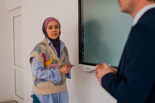 Manager and meeting or presentation in boardroom with coworkers for corporate business seminar. University teacher listening to Muslim student answering in the classroom. photo