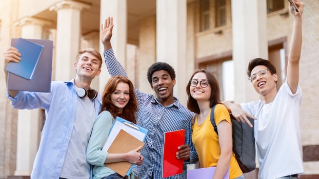 Happy First-Year Students Posing Standing Outside College Building, Excited About Entering University. Education Concept photo
