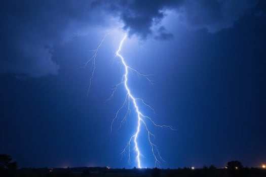 Dramatic Night Lightning Strike over Dark Landscape Powerful Nature Photography photo