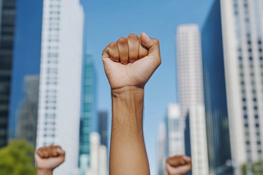 Raised Fist in Urban Setting photo