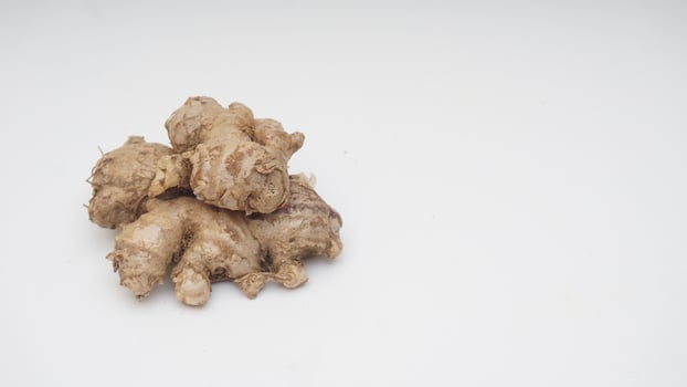 Ripe Ginger Spice on White Background photo