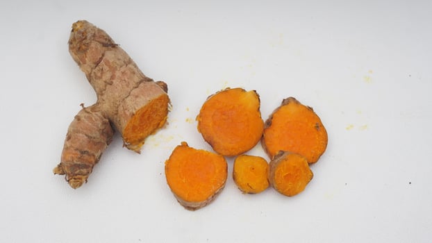 Slice of Ginger Spice on White Background photo