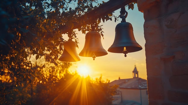Church bells hanging at sunset with sun rays shining through photo