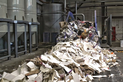 Large pile of shredded paper ready for recycling or disposal. Environmental concept. Pile of waste paper, cardboard and other recyclable materials ready for processing. Recycling and waste management photo