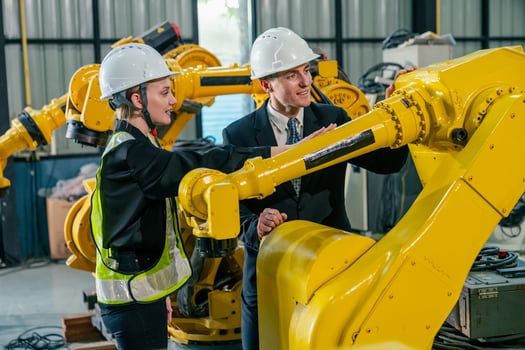 Engineers collaborate in a robotics workshop, discussing automation and technology advancements in the facility photo