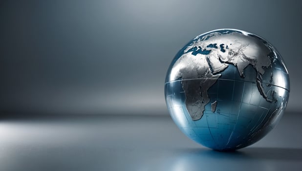 a globe on a table with a silver background photo