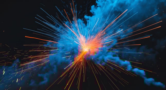 A blue and orange explosion with sparks photo