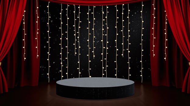 An elegant stage with a circular podium, illuminated by string lights against a backdrop of red curtains. photo
