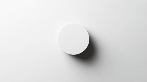 A white round object on a white wall photo
