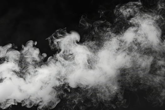 Swirling tendrils of white smoke weave in the air, their delicate forms beautifully set against a stark black backdrop, evoking mystery and artistry photo