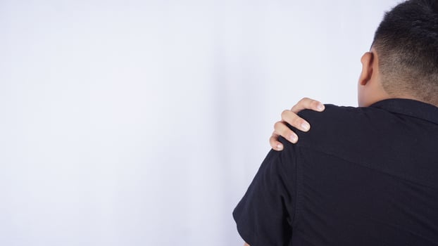 Rear View of Man Suffering from Stiff Muscle with Pain on White Background photo