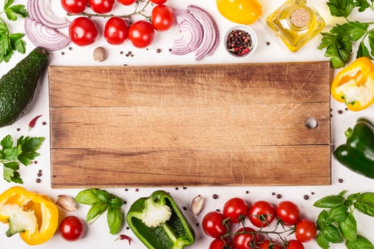 Fresh Organic Vegetables and cutting board with place for text. Healthy food or diet concept photo
