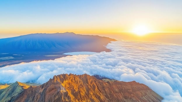 Aerial view of scenic mountain range with sun rising above clouds photo
