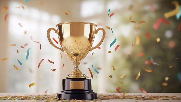 gold trophy on a table with confetti and confetti falling on it photo