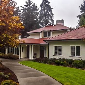 Stunning Suburban Home with Red Tile Roof and Landscaped Yard photo