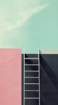 A black wall and a pink wall rise against a clear blue sky, with a white ladder connecting the two structures, creating a striking visual contrast photo
