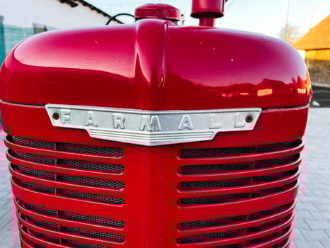 Kyiv, Ukraine - March 04, 2025- Front view of a vintage red tractor with Farmall branding outdoor photo
