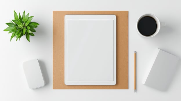 A white tablet sits on a wooden surface with a pen and a cup of coffee photo