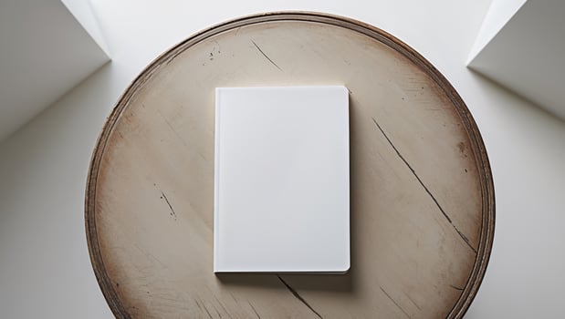 A white book on a table photo