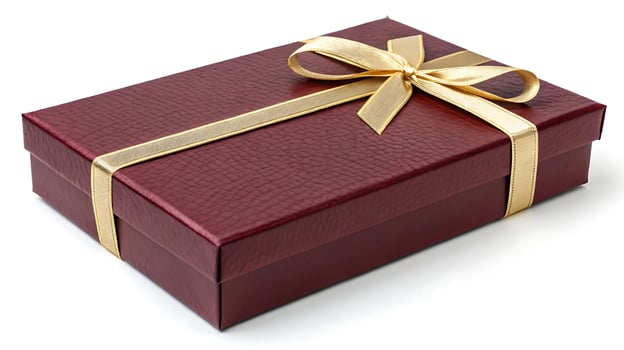 Elegant maroon gift box with gold ribbon bow, textured surface photo