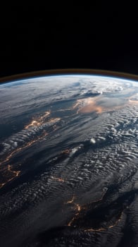 The earth from space with lights and clouds photo