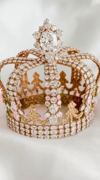 A crown made of diamonds sits on a bed photo
