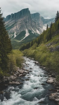 A river flowing through a mountain valley with trees and mountains photo