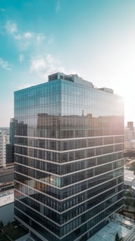 A large glass building with a blue sky photo