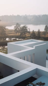 A white building with a lake in the background photo