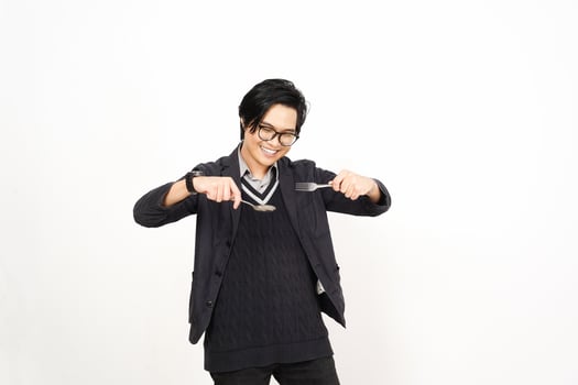A man in glasses holding a knife and fork photo