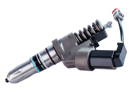New fuel injector on the white background close up photo