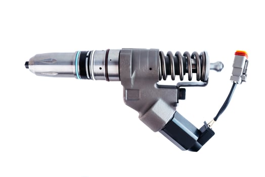 New fuel injector on white background closeup photo