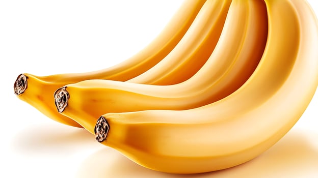 A cluster of ripe bananas arranged artistically against a plain white background photo