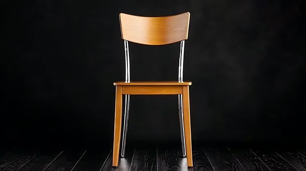 A minimalist wooden chair with a sleek design placed against a dark background, highlighting its elegance photo