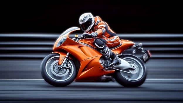 A racer in an orange motorcycle speeds down a blurred racetrack, showcasing precision and adrenaline photo