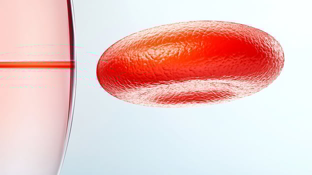 Close-up of a red blood cell in motion near a syringe, illustrating medical research and health photo