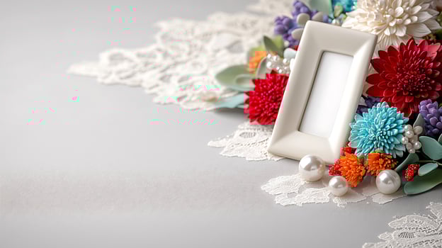 Colorful floral arrangement with lace and empty frame on a soft gray background, perfect for decoration photo