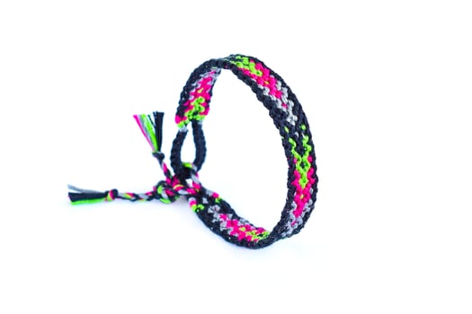 woven DIY friendship bracelets isolated on white background photo