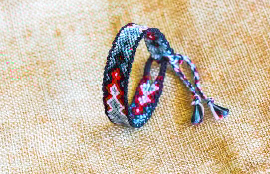 DIY woven tied friendship bracelet. Summer accessory photo