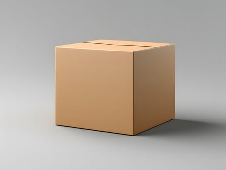 A cardboard box sitting on a gray surface photo