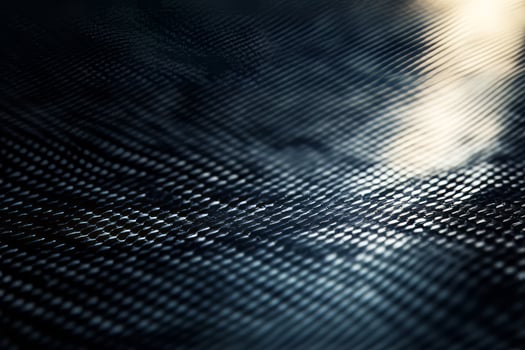 Abstract texture of a dark, reflective surface with intricate patterns. photo