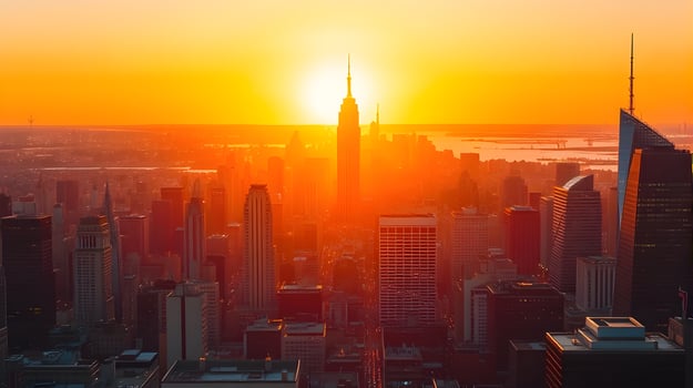 The sun rises over the city skyline in new york photo