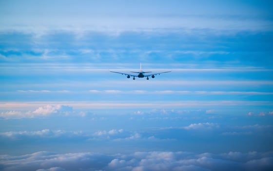 A large airplane flying through the sky photo