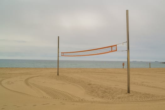 A volleyball net on a beach photo