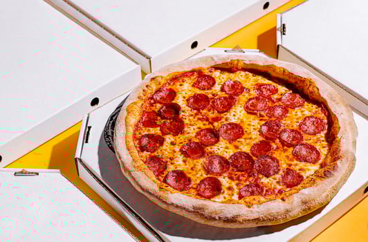 Delicious pepperoni pizza ready to share at lunchtime gathering photo