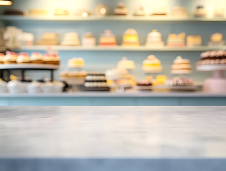 Light Grey Countertop with Blurred Bakery Background photo