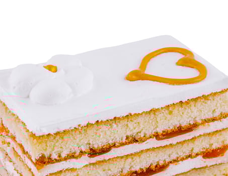 Delicious square cake with white icing and heart decoration photo